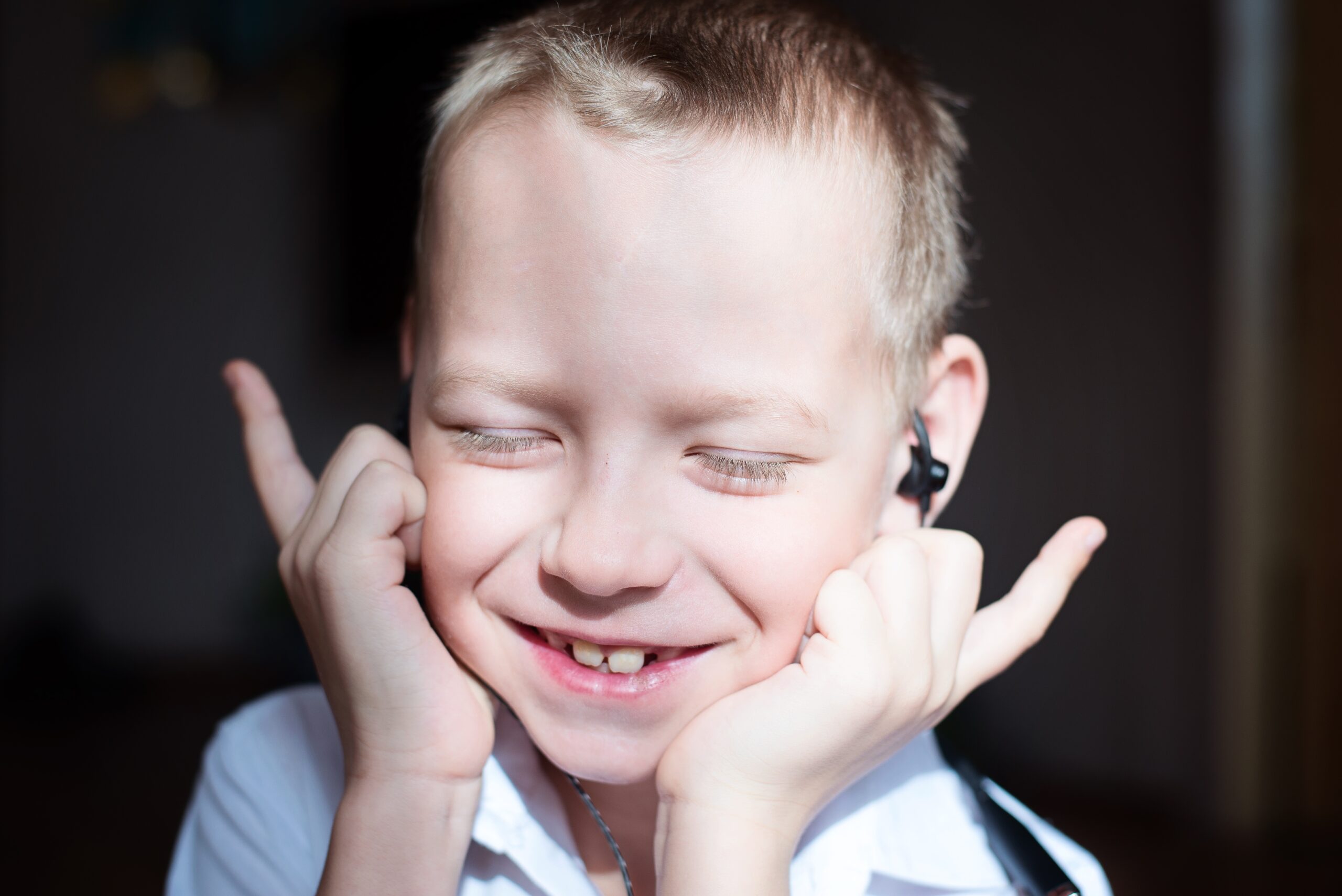 the boy listens to music with headphones 2025 01 08 20 37 46 utc scaled